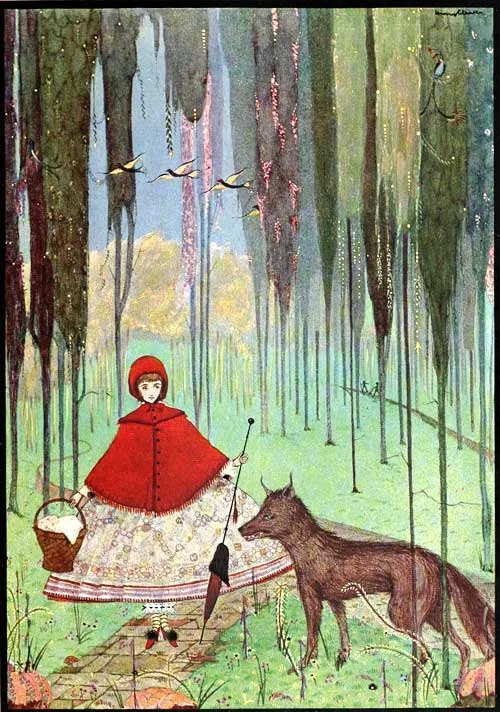 A girl in a red hood meets a watchful wolf on a flowered woodland path.